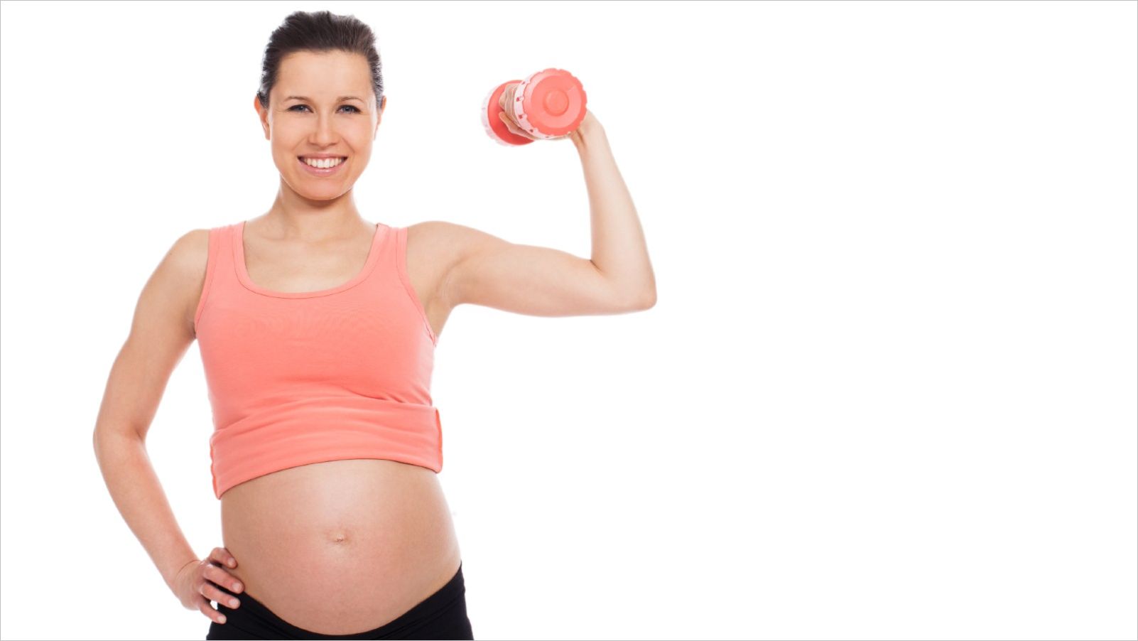 Pregnant woman exercising with a dumbbell